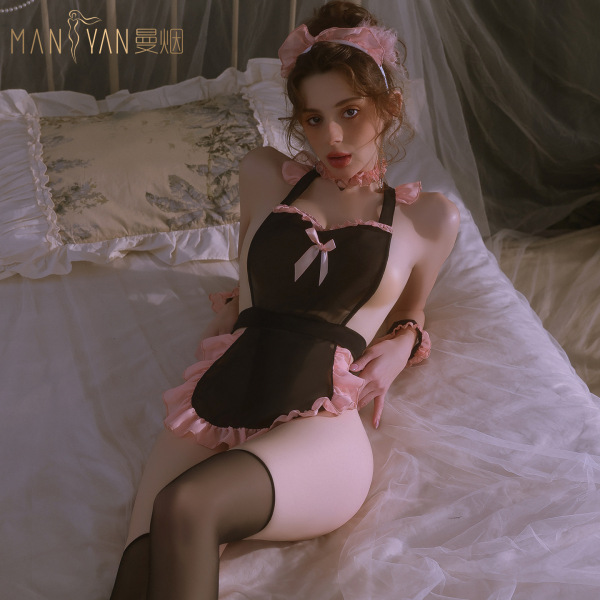 Woman wearing mannyan sexy lingerie set - sheer black maid costume with pink lace trim, adjustable straps, and backless desig...