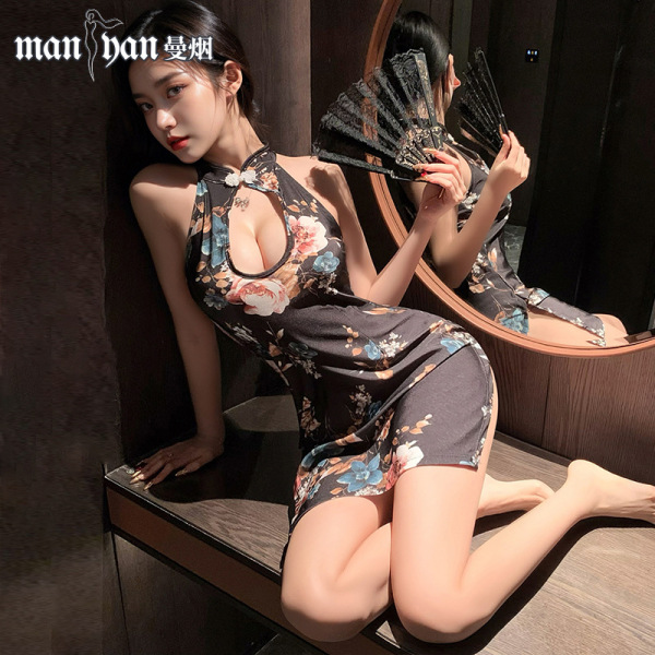 Woman in mannyan sheer qipao lingerie, elegant floral mini dress with vintage allure, posing seductively by mirror.
