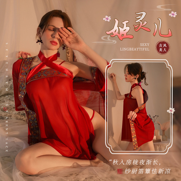 Woman wearing red mannye qing sheer sleep gown with hanfu-inspired design, featuring delicate embroidery and flowing sleeves.