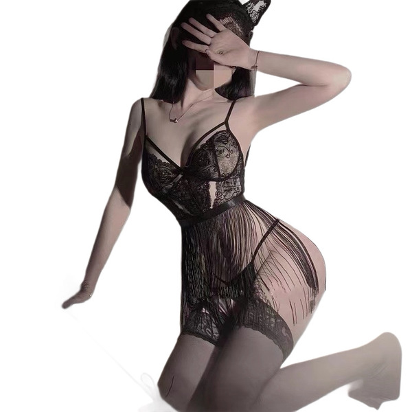 Woman modeling black lace bodysuit with sheer mesh and open-crotch design, featuring delicate floral patterns and elegant str...