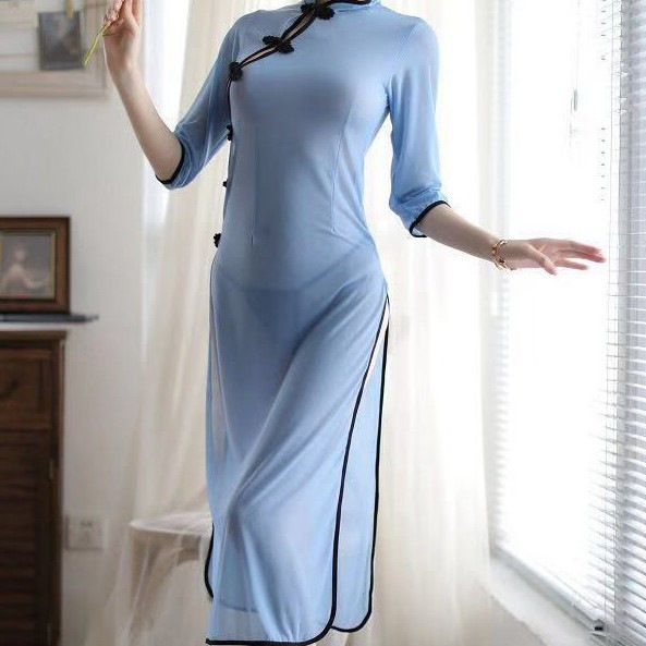 Elegant light blue mannyqing cheongsam with sexy side slit, sheer fabric design, perfect for evening wear.