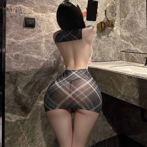 Woman in manyan ol secret cosplay uniform: sheer plaid bodysuit with backless design and bodycon skirt, posing in marble bath...