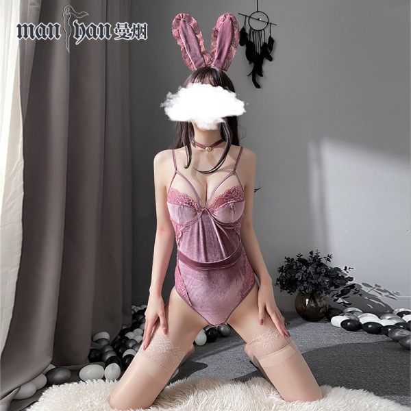 Woman modeling pink velvet bunny lingerie set with open-crotch bodysuit, lace trim, and thigh-high stockings for role play.