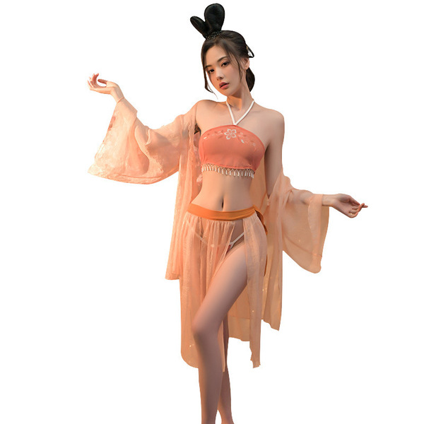 A woman models a miko classical chinese lingerie set, featuring a peach-colored top with floral embroidery and sheer, flowing...