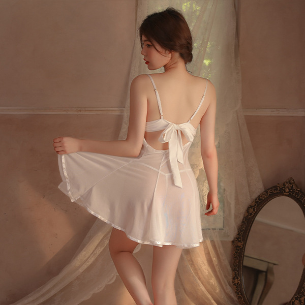 A woman models the minaer sexy mesh sleepwear set, featuring a sheer lace nightgown with backless straps and a bow detail, pa...