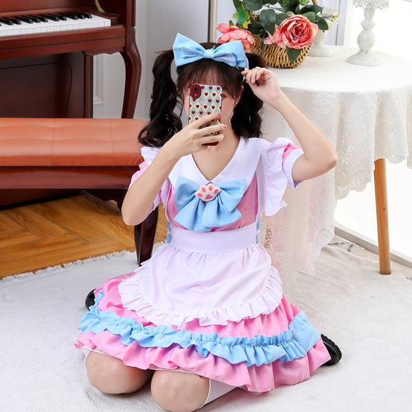 A girl wearing a pink and blue maid outfit with ruffles, holding a phone to take a mirror selfie indoors near a piano and tab...
