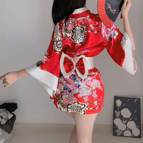 A woman models a vibrant red muran new japanese kimono with playful floral patterns, featuring a bow tie and elegant design, ...