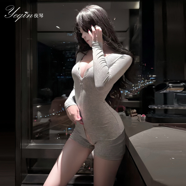 Woman modeling night lady lingerie set - a form-fitting, long-sleeve bodysuit with deep v-neck and open-crotch design.