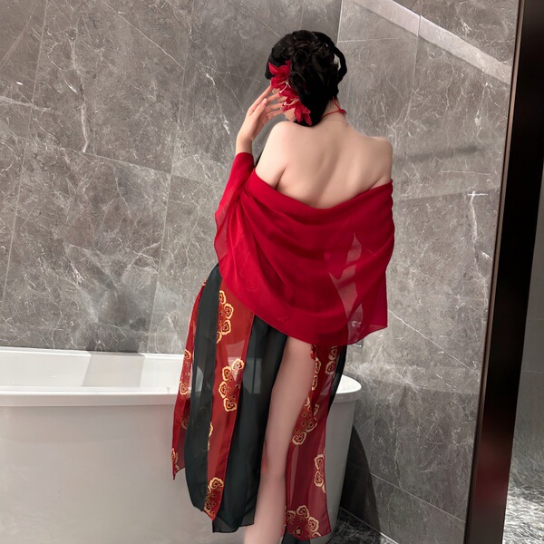 A woman stands by a bathtub wearing a red night silk sensual hanfu lingerie set inspired by cheongsam, featuring a flowing de...