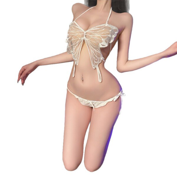 Woman wearing a white butterfly-themed lingerie set with a sheer top and matching bottoms.