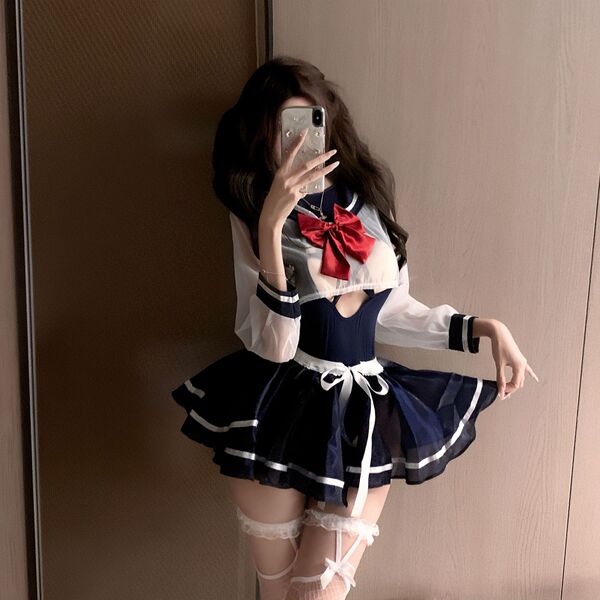 A person poses with a smartphone, wearing a night-su seductive lingerie set - two-in-one sailor uniform costume. the outfit f...