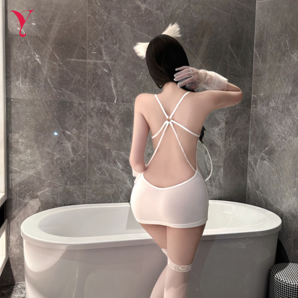 Woman wearing white lace-back sleepwear set with cat ears, posing by bathtub — night temptation seductive couples intimate ou...