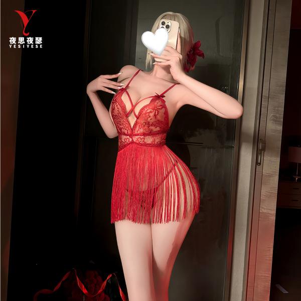 Woman modeling red lace nightsigh sleep dress with tassels, deep v neckline and tie-up straps for sexy nightwear.