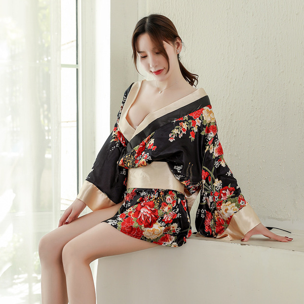 A woman models a japanese geisha-inspired sleepwear set featuring a floral kimono robe with a plunging neckline, perfect for ...