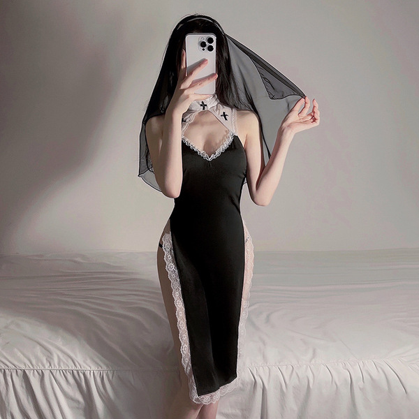 Sexy catholic role play outfit featuring a black lace-trimmed dress with sheer mesh skirt and detachable cross accessory, per...