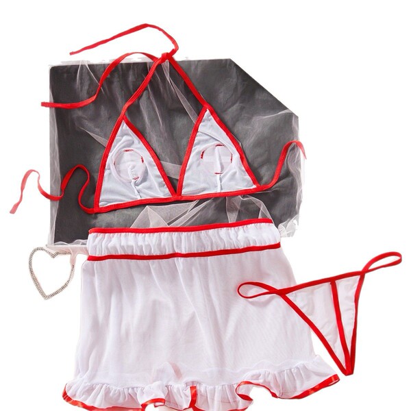 White and red nurse lingerie set with sheer top, lace trim, heart accessory, and matching thong for seductive role play.