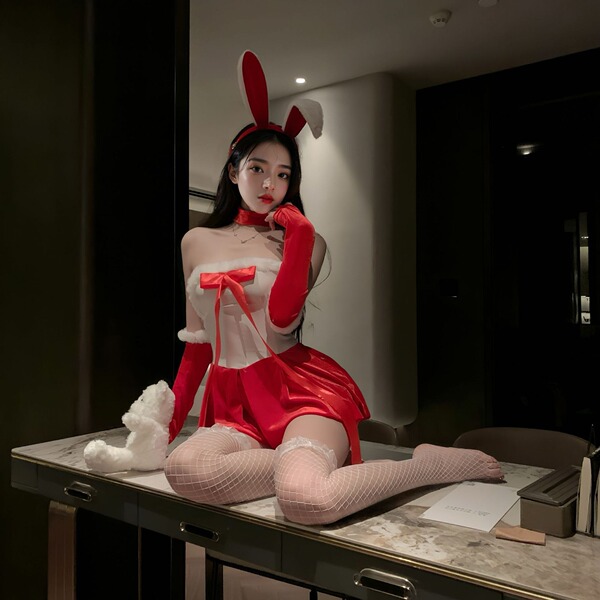 A woman poses in a paris bloom bunny girl costume, featuring a red and white outfit with bunny ears, gloves, fishnet stocking...