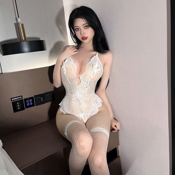 Woman modeling white lace passion lingerie set, ultra-thin backless bodysuit with cut-outs and open-crotch design.