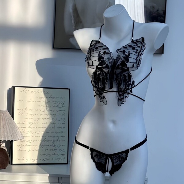 Sheer black butterfly lace bodysuit with pearl embellishments, featuring a sensual see-through top and tie-strap thong ensemb...