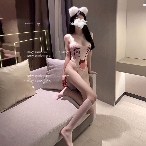 Woman wearing pink cartoon sexy bodysuit with playful anime design, open-crotch style, and fluffy ear headband in cozy bedroo...