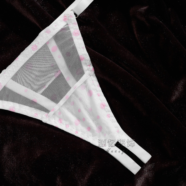 Sheer white bra with pink polka dots on dark velvet background - valentines day lingerie set