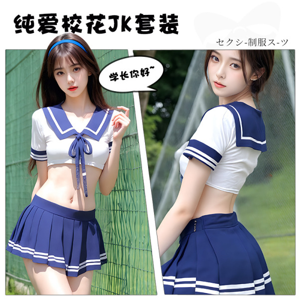 Model wearing playful japanese schoolgirl costume set with cute color-block collar, white crop top and blue pleated skirt for...