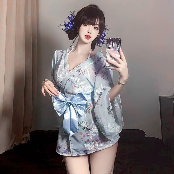 Woman wearing light blue floral kimono lingerie set with bow print, sheer robe sleepwear outfit.