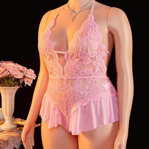 Pink lace bodysuit with halter neck design, featuring cut-outs and sheer fabric, perfect for women seeking elegant sleepwear.