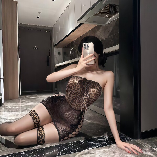 Woman in plus size leopard print lingerie dress with sheer mesh, posing on kitchen floor. no-undress design sexy outfit for w...