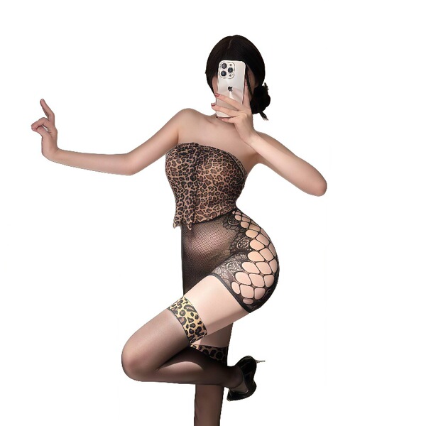 Woman posing in plus size leopard print lingerie dress with sheer mesh detailing and no-undress design.
