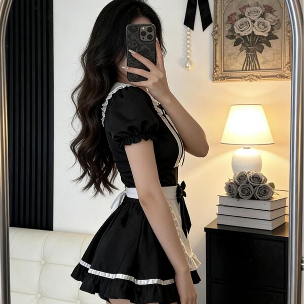A woman poses in a black maid costume with white accents, featuring puffed sleeves and a ruffled skirt, perfect for cosplay o...