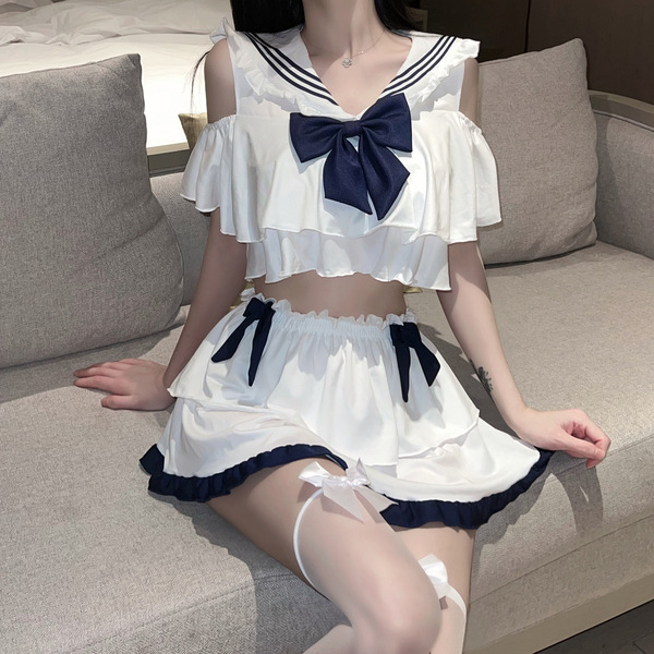 Seductive sailor-style lingerie set featuring a white crop top with navy accents and matching skirt, perfect for a playful jk...