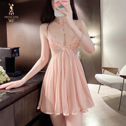 Woman wearing plus size sexy lace sleepwear, deep v thin cami nightgown in soft pink, elegant lingerie set.