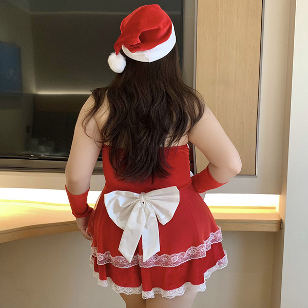 Sexy red dress with santa hat, festive bow, perfect holiday outfit for women.