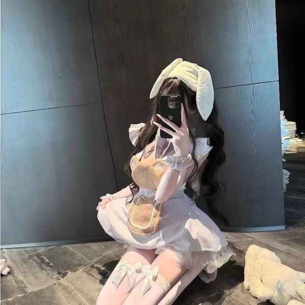 A person wearing a plus-size maid costume, featuring a flirty chef outfit with ruffled hem, sweet bunny ears, and playful acc...