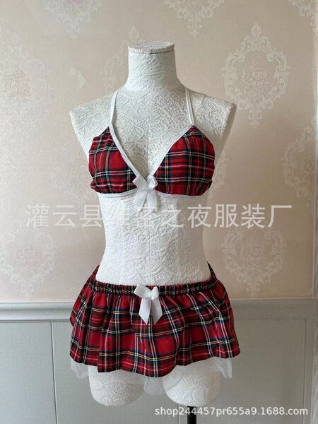 Red plaid three-piece lingerie set with white lace trim and bow details, displayed on a mannequin.