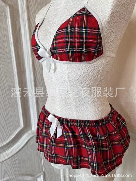 Red plaid three-piece lingerie set with white lace trim and bows, displayed on a mannequin.