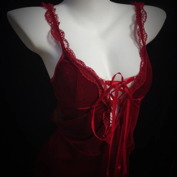 Red hot holiday bodycon dress with lace detailing and ribbon ties, perfect for festive celebrations.