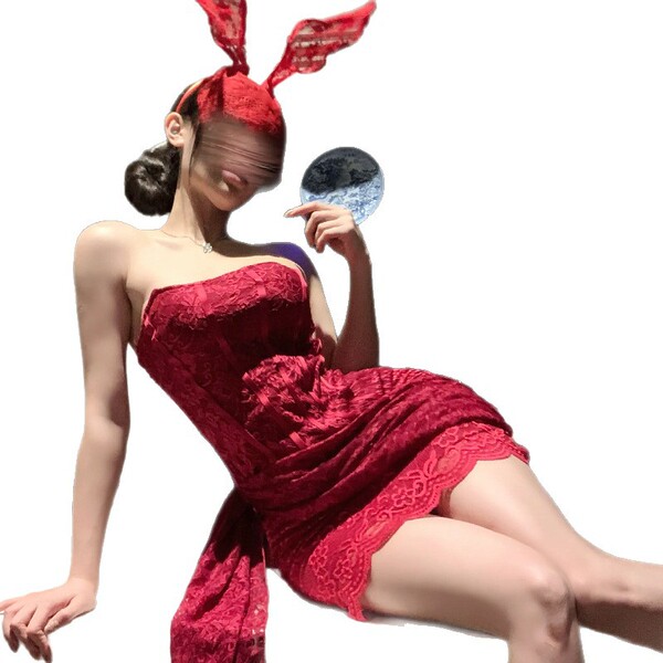 A woman poses elegantly in a sheer lace bandage mesh corset dress, featuring a strapless design with bunny ears headband. the...