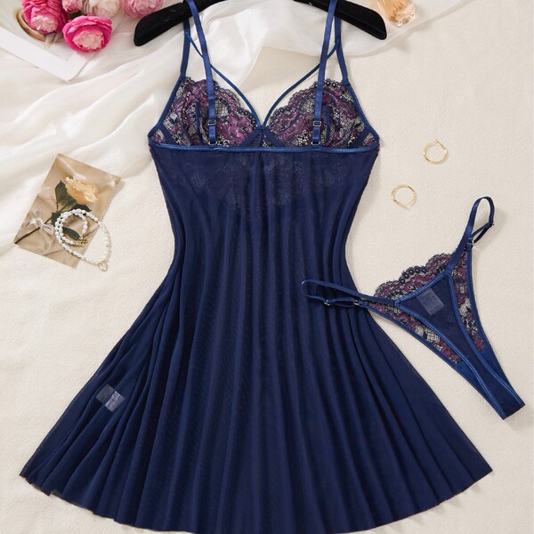 Navy blue lace sleep dress with sheer mesh, floral detailing, and matching thong. perfect for romantic evenings.