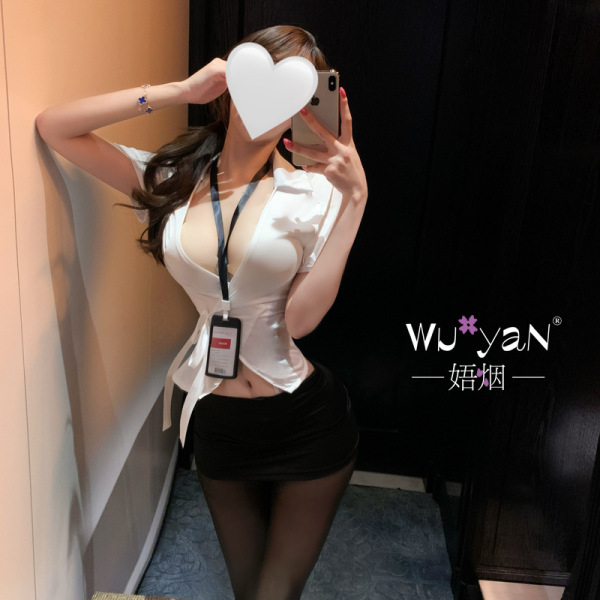 Woman in a white blouse and black skirt, showcasing the pure & alluring lingerie set - premium seductive secretarial style in...