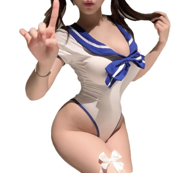 Woman wearing white and blue sailor-style lingerie set with bow detail, posing playfully — pure & alluring sexy student-style...