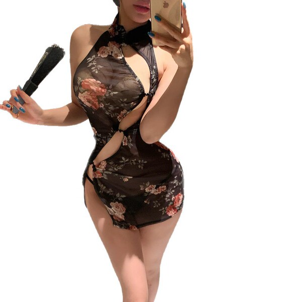 Woman in sheer floral qipao dress with high slit, holding phone and fan, showcasing vintage-inspired sexy lace-trimmed costum...