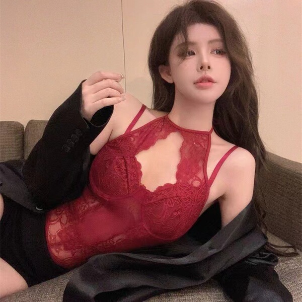 Woman wearing red lace halter bodysuit with black blazer, sensual slim-fit lingerie for layering.