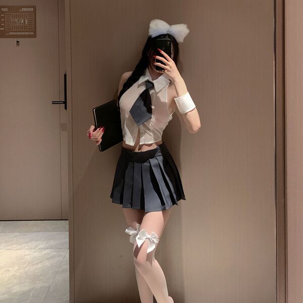 A stylish ensemble featuring a white chiffon shirt paired with a pleated black skirt, complete with a bow headband and knee t...