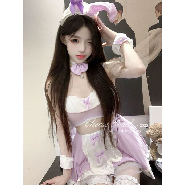 Woman wearing pure & playful bunny girl lingerie set – sexy cute sleepwear with purple bows, ears, and ruffles for seductive ...