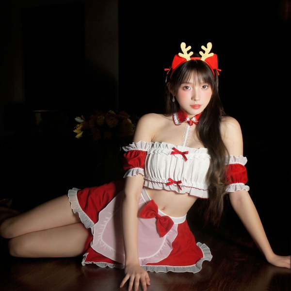 A woman poses wearing a festive christmas maid outfit, featuring a strapless design with red and white colors, cute antler he...