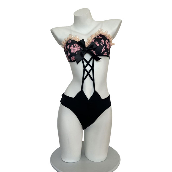 Black floral lace bikini set with bow detail and crisscross straps, sexy matching top and bottom lingerie outfit.