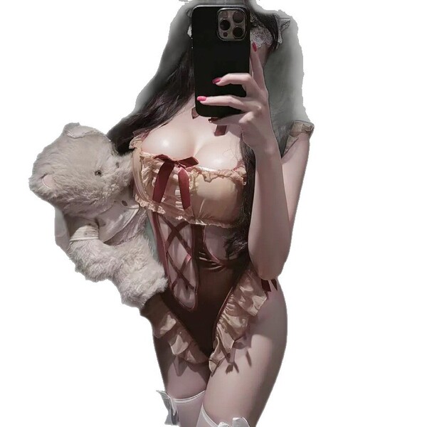 Woman in pure & playful lingerie bodysuit holding teddy bear, soft cute open-crotch sleepwear with adjustable straps.