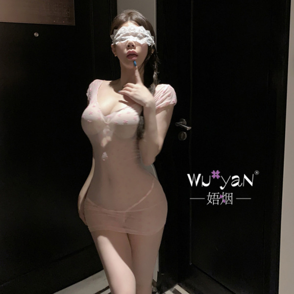 Woman wearing a sheer pink lingerie set with lace details and blindfold, featuring the pure & playful lingerie set – minimali...